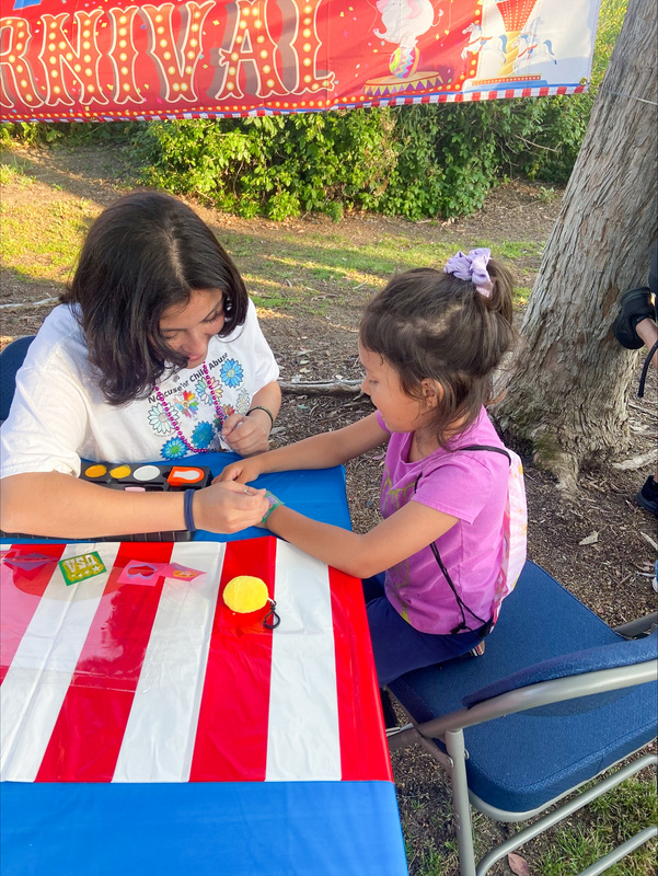 A child colors at an event