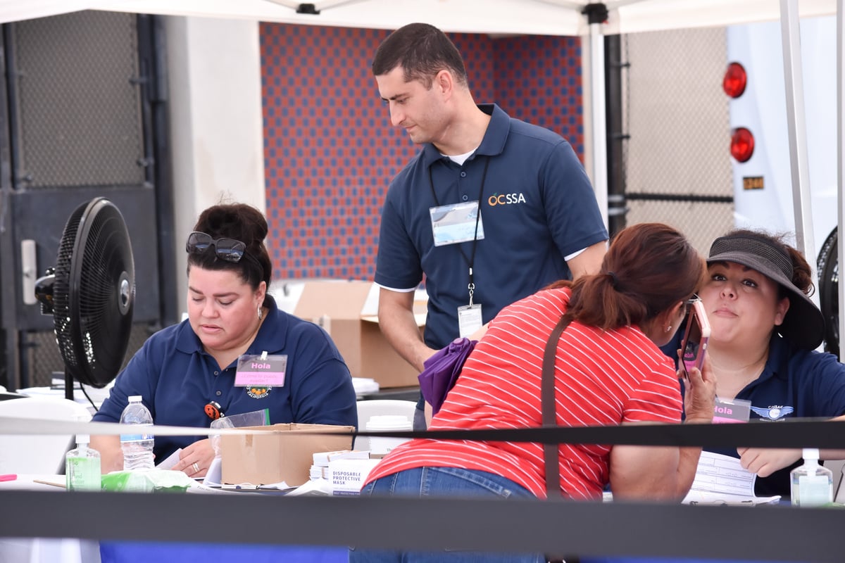 A client talks with a Social Services Agency employee